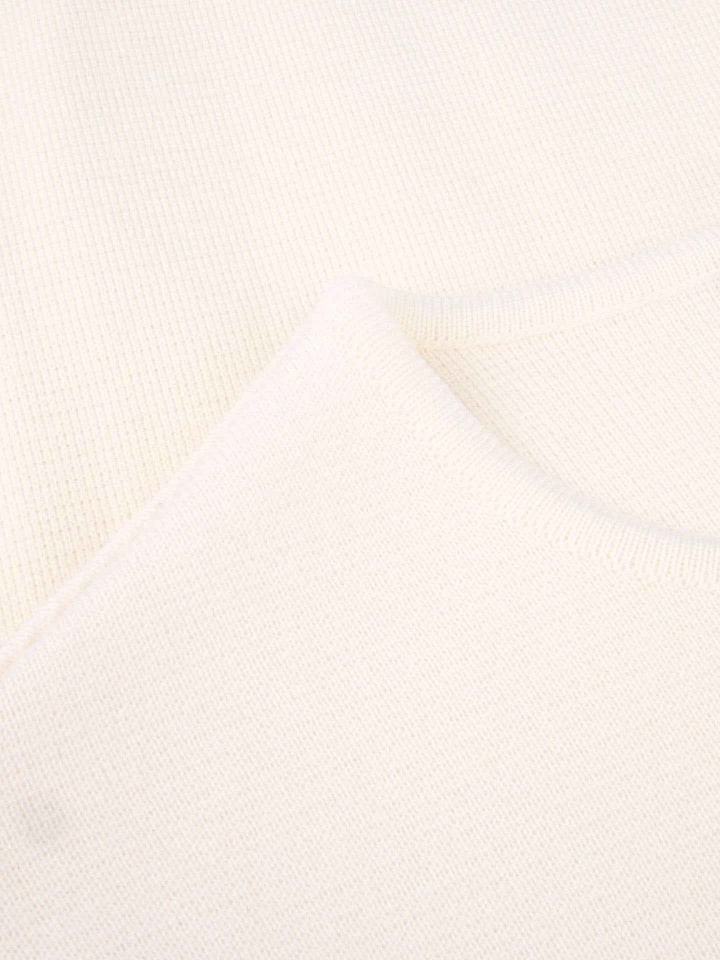 Lo Stickad Poncho i Merinoull